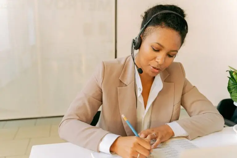 Image: receptionist filling out paperwork