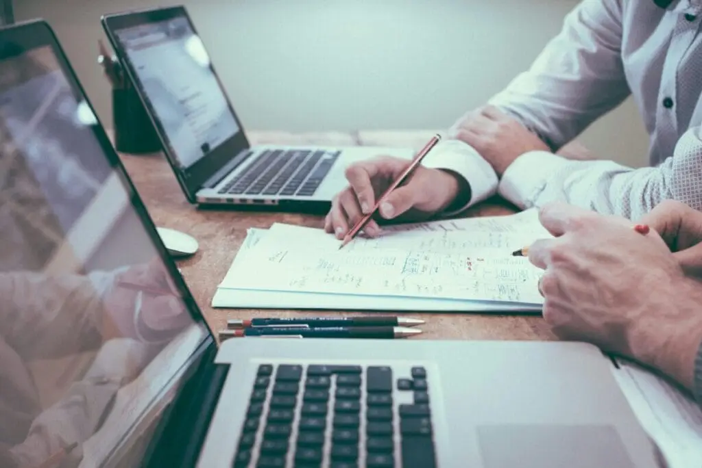 Image: Advisors looking at financial documents